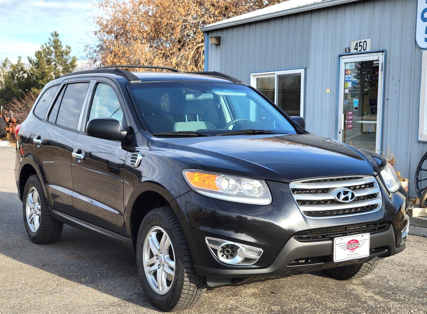 2012 Black /Tan Hyundai Santa Fe Premium (5XYZGDAB1CG) with an 2.4L I4 engine, 8 Speed Automatic transmission, located at 450 N Russell, Missoula, MT, 59801, (406) 543-6600, 46.874496, -114.017433 - NICE AWD SUV. Automatic Transmission. Air. Cruise. Tilt. Power Windows and Locks. AM FM XM Cd Player. Bluetooth. Two Sets of Tires. Studded Snow Tires are currently on. - Photo#10